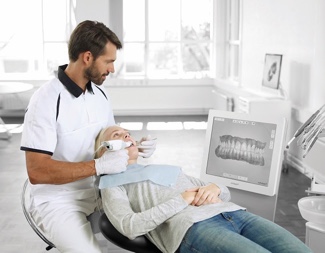 Dental technician performing a 3D intraoral scan